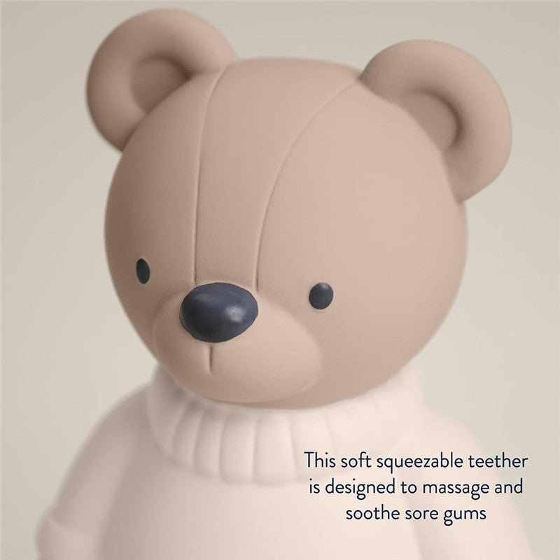 Soft bear-shaped teether made of natural rubber, designed to massage and soothe sore gums.