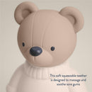 Soft bear-shaped teether made of natural rubber, designed to massage and soothe sore gums.
