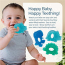 Baby holding an Itzy Ritzy water-filled teether shaped like a dinosaur, with two other similar teethers visible.