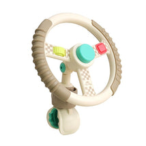 Taupe steering wheel toy with a turquoise button, colorful controls, and checkered accents, designed for children’s pretend play.