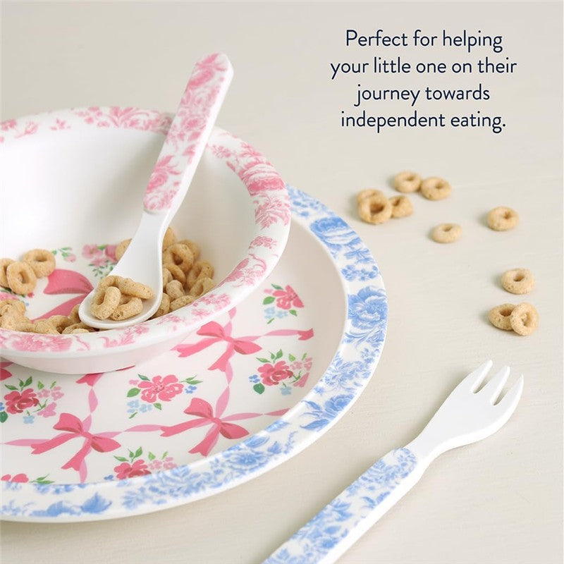 Bistro 4-piece dining set featuring a pink floral bowl, blue rimmed plate, spoon, and fork, accompanied by cereal.