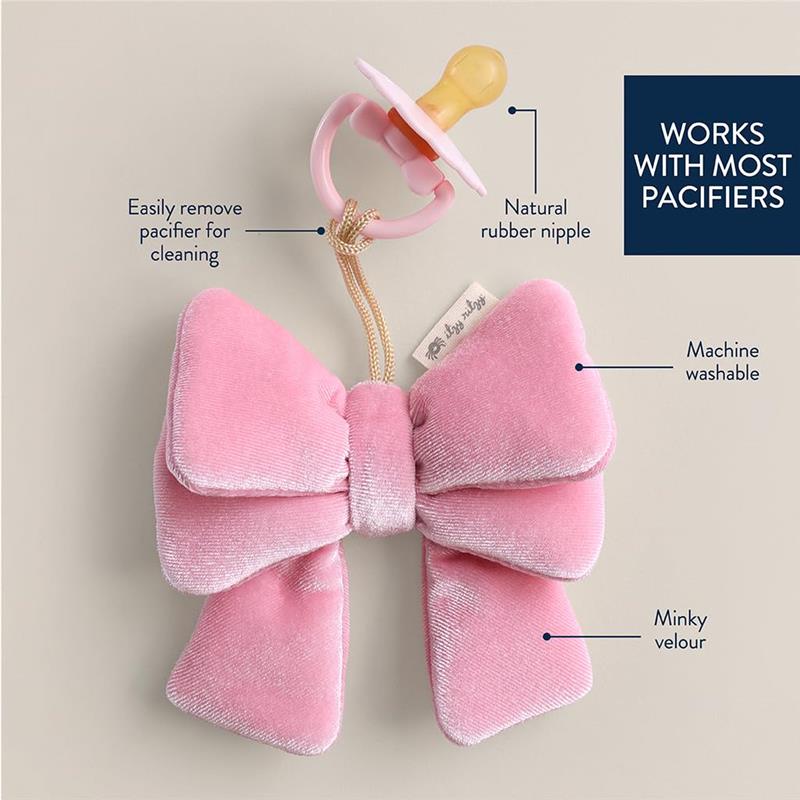 Pacifier holder in the shape of a pink velvet bow, compatible with most pacifiers, machine washable, and easy to clean.
