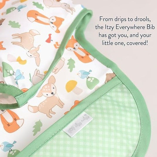 Water-resistant Itzy Ritzy Itzy Everywhere Bib with animal prints and a green trim, designed to protect children from messes.