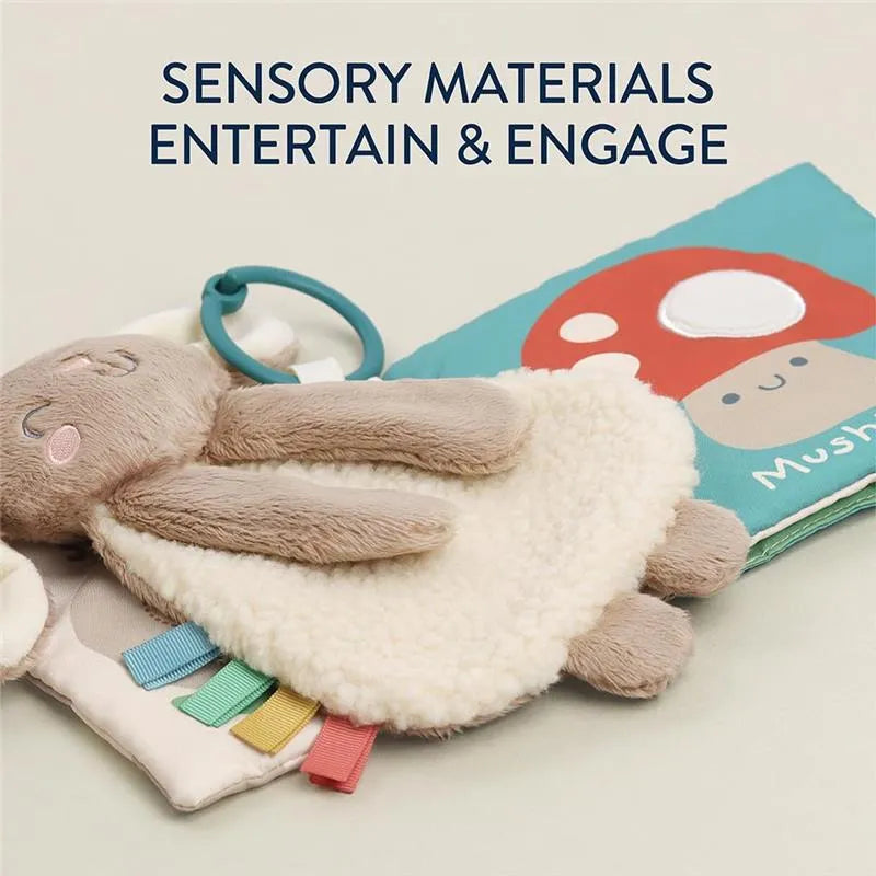 Itzy Ritzy Learn & Snuggle Gift Set featuring a soft bunny toy, sensory textures, and colorful tags for engagement.