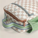 Itzy Ritzy Itzy Lunch Box™ toddler bag featuring a checkered pattern, zip closure, and green striped handle.