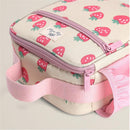 Toddler lunch box with a pink strawberry print, featuring a zippered compartment and a soft pink handle.