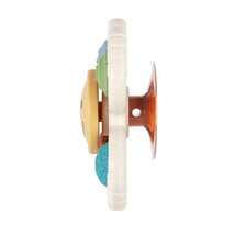 Itzy Ritzy Itzy Pop & Whirl toy, featuring colorful textured discs designed for sensory play and motor skill development.
