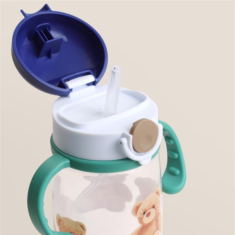 Straw cup with a snap-close lid features a light blue handle, a clear body, and teddy bear designs on the front.