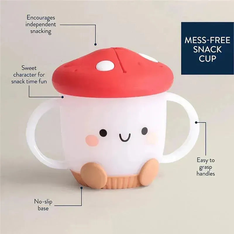 Mushroom-shaped Itzy Snack Cup™ with a smiling face, easy-to-grasp handles, and a no-slip base, promoting mess-free snacking.