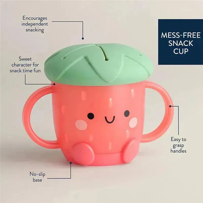 Mess-free snack cup designed for children, shaped like a strawberry with a green lid, featuring easy-grip handles and a no-slip base.