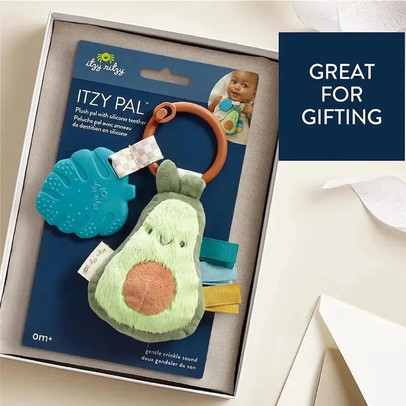 Plush avocado toy with silicone teether and colorful tags, packaged for gifting. Ideal for infants and toddlers.