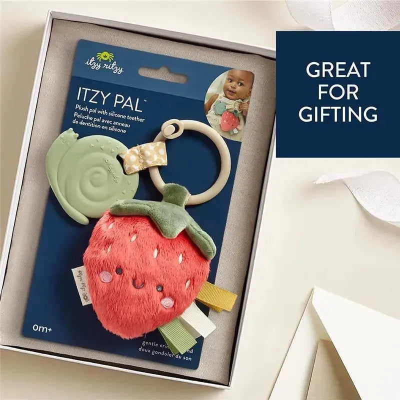 Plush strawberry teether with a silicone ring and snail; packaged for gifting, featuring a smiling face and colorful tags.