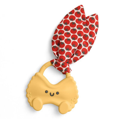 Pasta-shaped silicone teether with a smiling face, featuring a red tomato-patterned crinkle tie attached.
