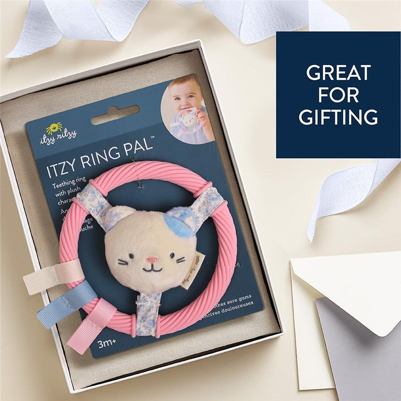 Teething ring with a plush kitty design, packaged for gifting, featuring soft pink rubber and blue fabric accents.
