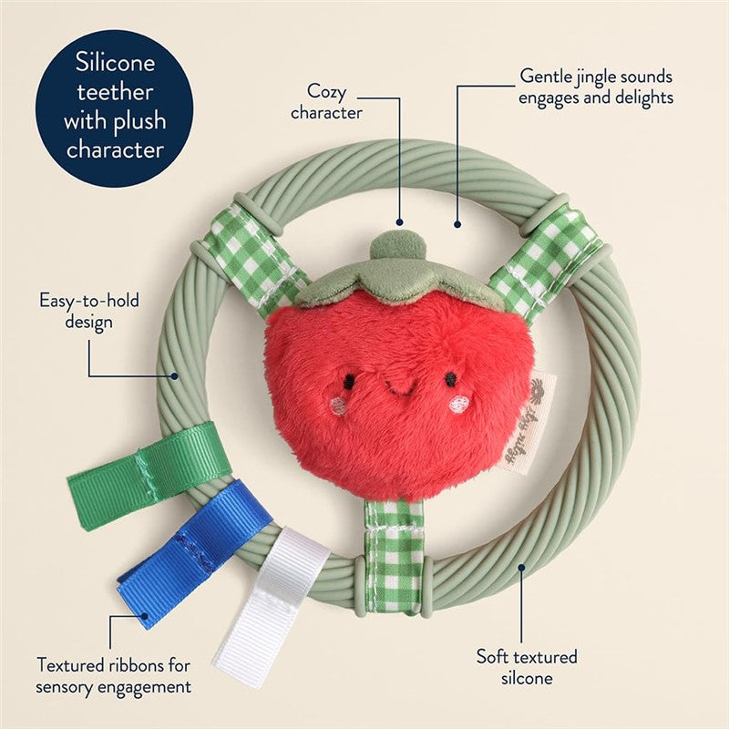 Silicone teething ring featuring a plush tomato character with textured ribbons for sensory engagement and soft silicone design.