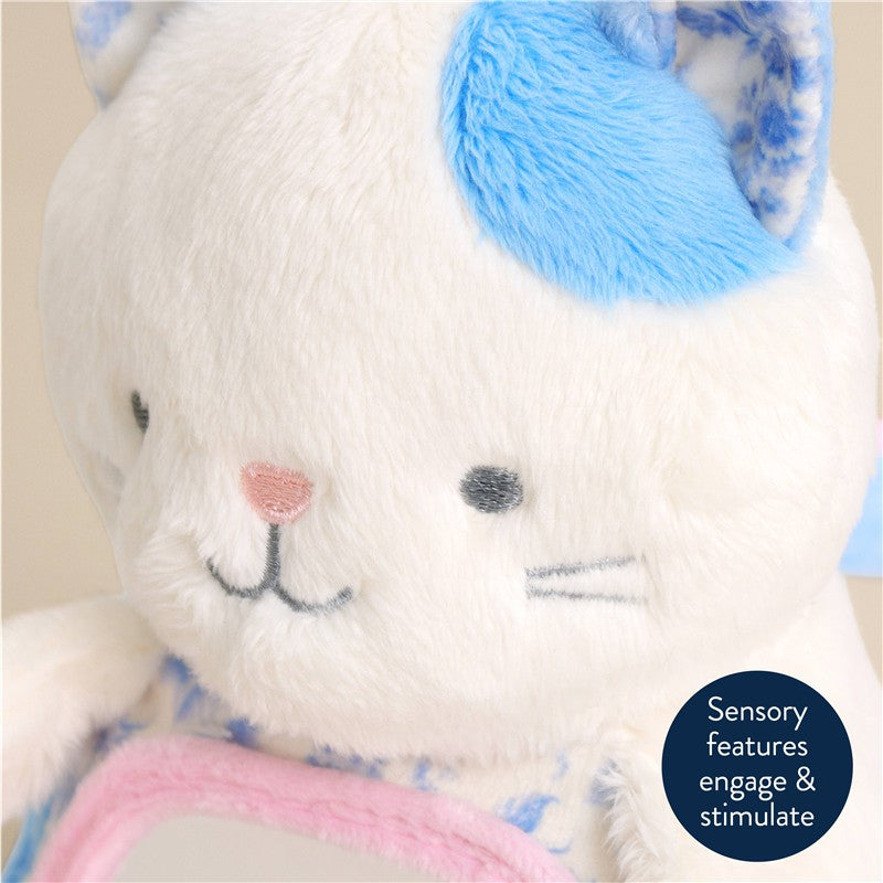 Sensory Tummy Time Mirror featuring Kinsley the Kitty, a plush toy with blue and white fur and facial features.