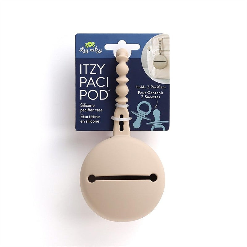Itzy Ritzy Paci Pod in Toast color, a silicone case designed to hold two pacifiers, featuring a round shape and decorative handle.