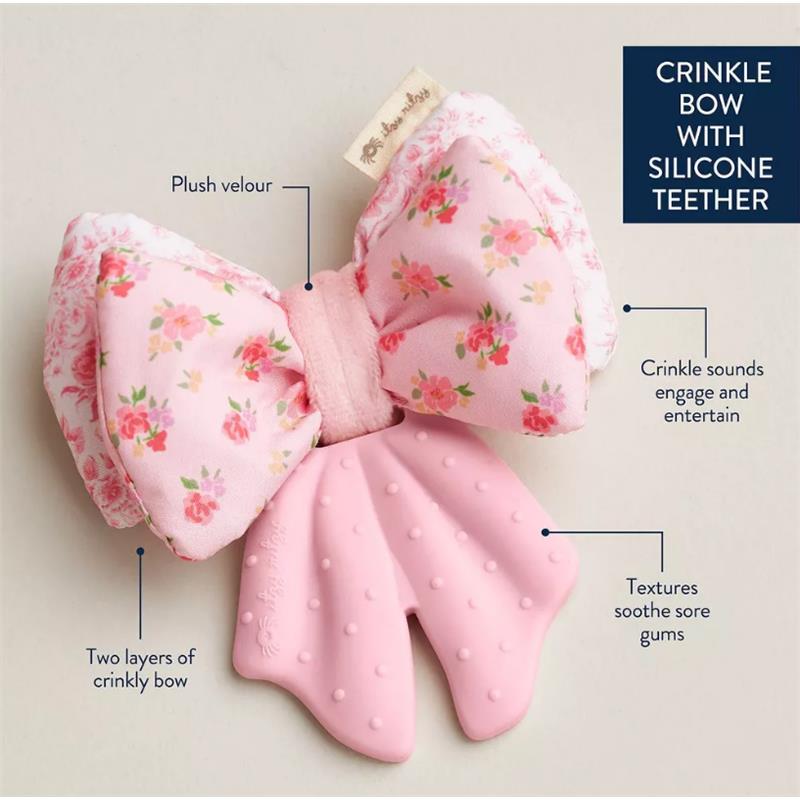 Silicone sensory teether shaped like a bow, featuring plush velour, crinkle sounds, and textured silicone for soothing gums.