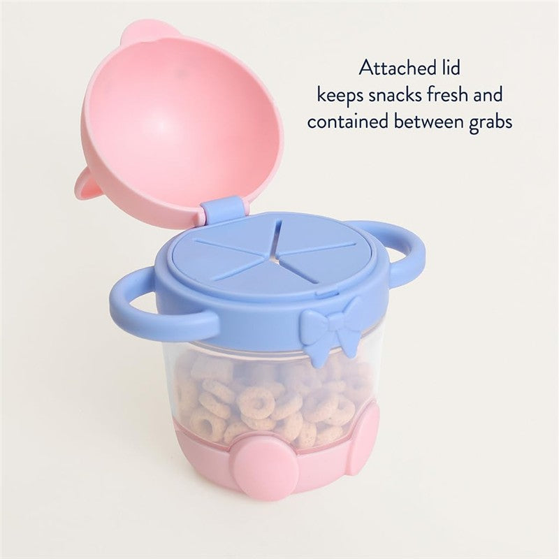 Kitty-themed Itzy Ritzy Snack Pal Snack Cup with a pink lid and blue base, designed to store snacks securely.