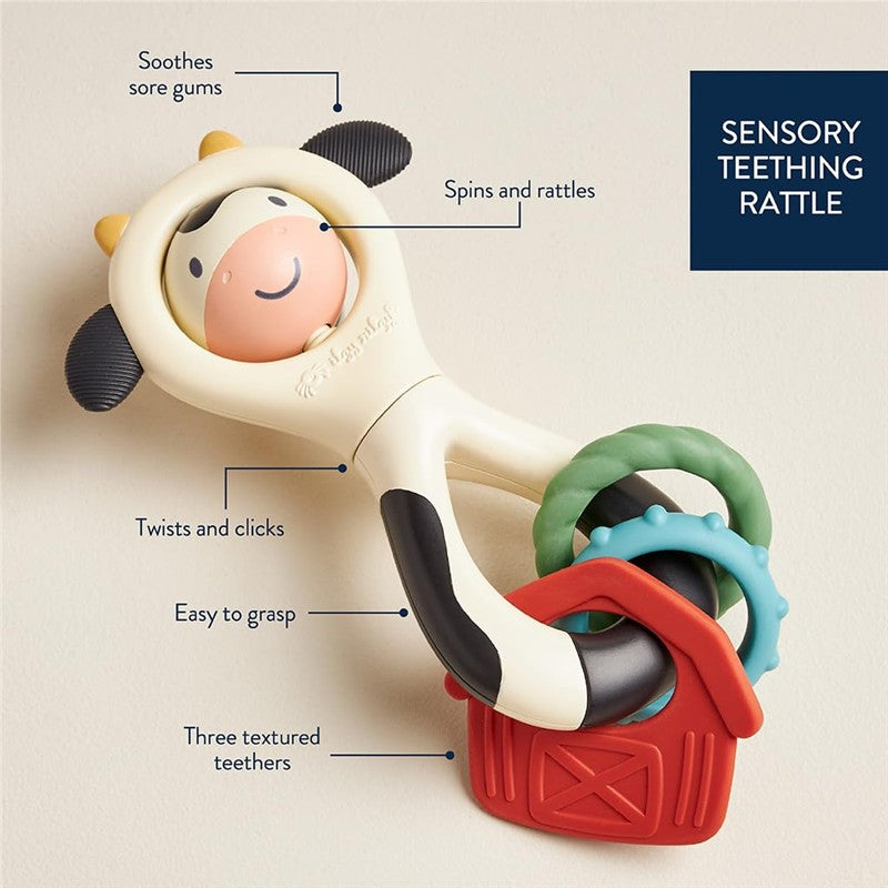 Spinner rattle cow toy designed for soothing sore gums, featuring spinning and rattling elements, textured teethers, and an easy-grasp handle.