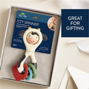 Spinner rattle in cow shape with colorful rings, packaged for gifting; suitable for ages 3 months and up.