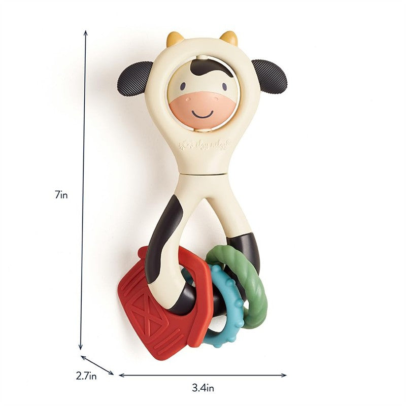Spinner Rattle Cow from Itzy Ritzy, featuring a smiling cow design with colorful textured rings for sensory play.