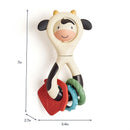 Spinner Rattle Cow from Itzy Ritzy, featuring a smiling cow design with colorful textured rings for sensory play.
