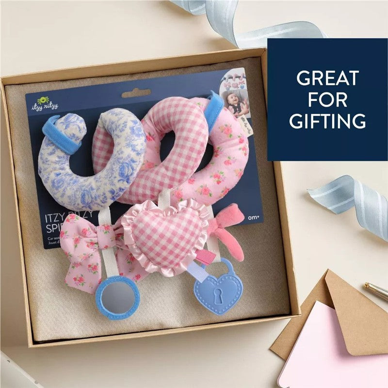 Spiral car seat activity toy set featuring floral and gingham patterns, includes rings, a heart, and a mirror, packaged for gifting.