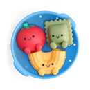 Itzy Ritzy Splash Pals™ Wash and Play Squirter Set featuring three colorful food-shaped toys: a red tomato, a green ravioli, and a yellow macaroni.
