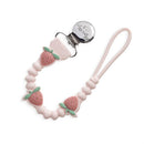 Strawberry-themed silicone pacifier clip with beads and a metal clip for securing pacifiers.