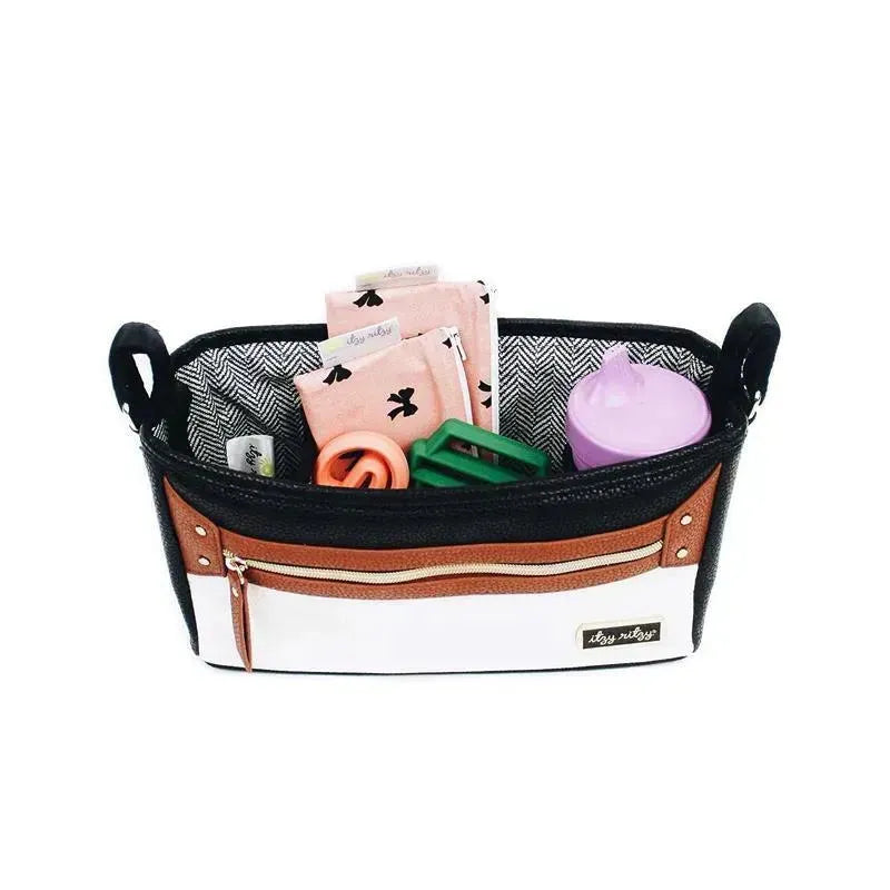 Stroller caddy in coffee and cream colors, featuring compartments for baby items and a pink sippy cup.