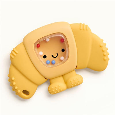 Yellow croissant-shaped teething and rattle toy featuring a smiling face and colorful beads inside for added engagement.
