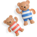Wind-up bath toys featuring two bear figures, one in a blue and white striped swimsuit and the other in red and white stripes.