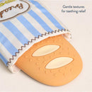 Teething relief silicone teether shaped like a baguette, partially covered by a blue and white striped fabric.
