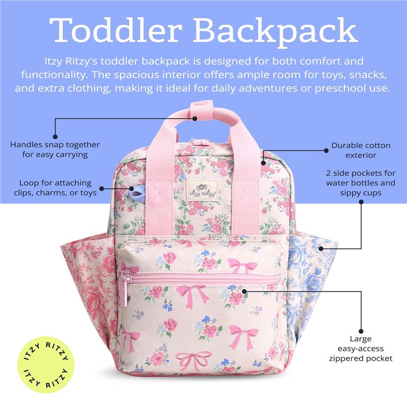 Toddler backpack by Itzy Ritzy in floral design with pink straps, features side pockets, a front zippered pocket, and a clip loop.