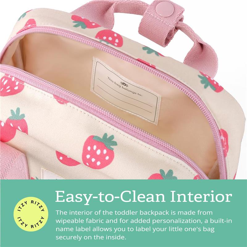 Toddler backpack from Itzy Ritzy with a strawberry design, featuring a wipeable interior and a name label for personalization.