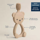360-degree training toothbrush designed as a cute bear, featuring soft silicone bristles and a comfortable grip for babies and parents.