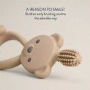360-degree training toothbrush in the shape of a bear, designed for early dental care with a soft, textured bristle head.