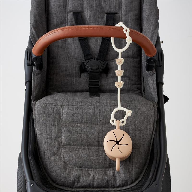 Toy and snack cup strap designed for strollers, featuring a cute bear motif and a secure attachment point.