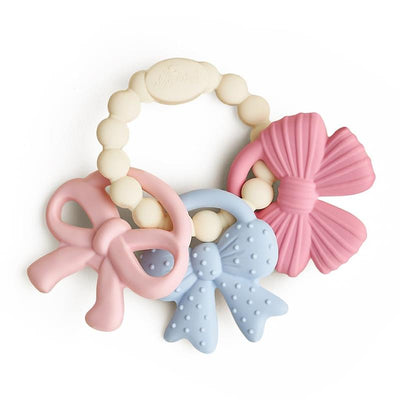 Multi-textured silicone teething toy featuring three bow shapes in pink and blue, with a bead ring for easy grip.
