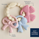 Multi-textured silicone teether featuring colorful bows, designed for sensory exploration and soothing sore gums.