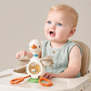 Baby playing with Itzy Ritzy Twist & Bop High Chair Sensory Activity Toy - Goose, featuring colorful beads and soft, graspable elements.