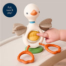 Sensory toy featuring a whimsical goose design, with a yellow textured element and interactive components for tactile play.