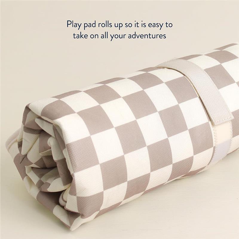 Taupe checkerboard play mat rolled up, featuring a strap for easy transport, with text about its portability above.