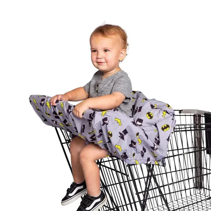 Shopping cart cover featuring a toddler sitting comfortably, adorned with Batman-themed designs in gray and yellow.