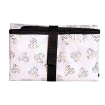Disney Baby changing pad featuring Mickey Mouse silhouette patterns in pink and black, secured with a black strap.