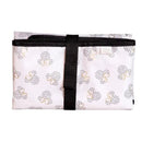 Disney Baby changing pad featuring Mickey Mouse silhouette patterns in pink and black, secured with a black strap.