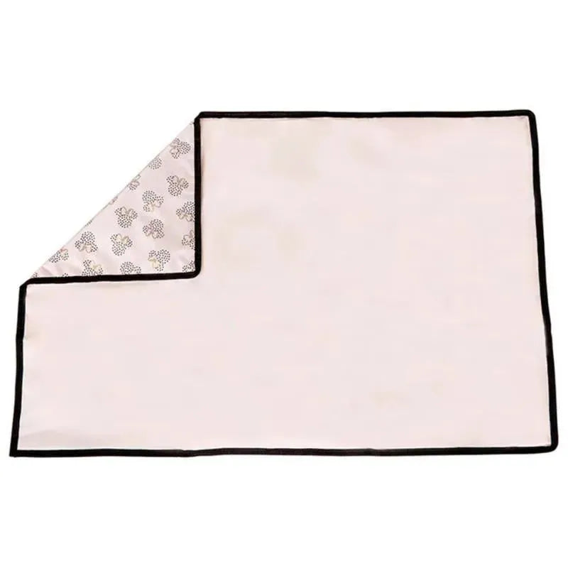 Disney Baby Full Body Changing Pad in pink with a Minnie Mouse dot pattern and black trim.