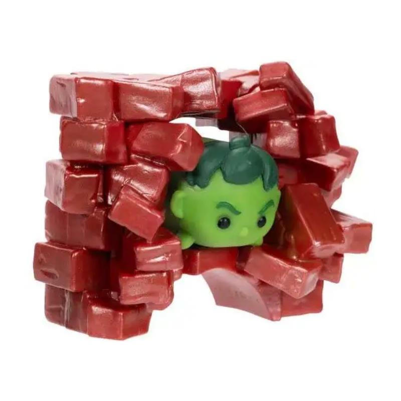 Marvel-themed toy set featuring a green Hulk figure peeking through a pile of shiny red building blocks.