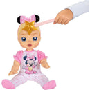 Interactive 13-inch blonde-haired baby doll wearing a pink outfit with Minnie Mouse design, being playfully waved at with a star wand.